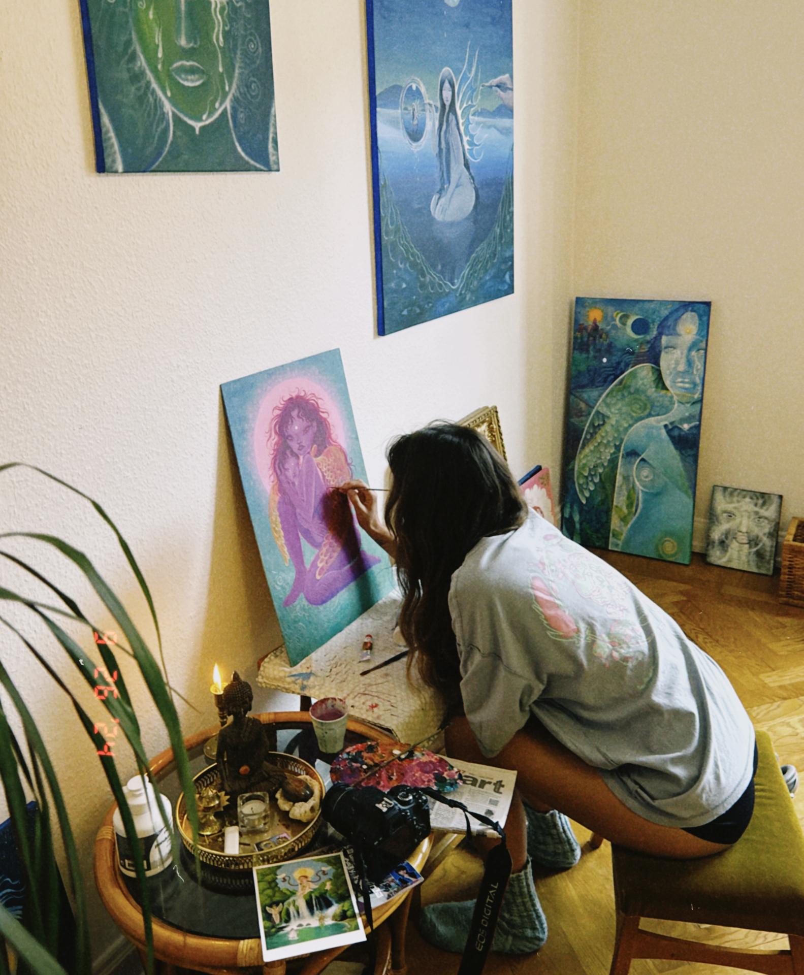 Norea painting in her studio